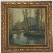 A gilt framed oil on canvas depicting a river scen