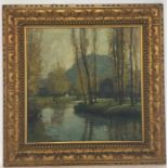 A gilt framed oil on canvas depicting a river scen