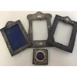 A large group of embossed dome top picture frames