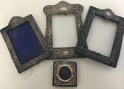 A large group of embossed dome top picture frames