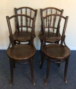 A set of four bentwood chairs with turned supports