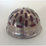 A large domed top silver pin cushion with pierced