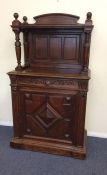 A Continental oak sideboard with panelled back, sh