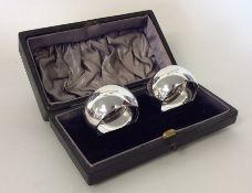 A boxed pair of plain silver napkin rings. Sheffie