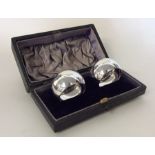 A boxed pair of plain silver napkin rings. Sheffie