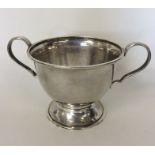 A stylish silver two-handled bowl of textured form