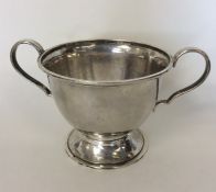 A stylish silver two-handled bowl of textured form