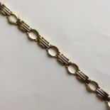 A 9 carat two colour gold bracelet with concealed