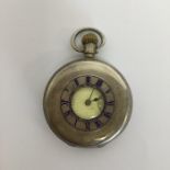 A silver half Hunter pocket watch with white ename