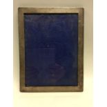 A rectangular large plain silver picture frame. Lo