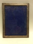A rectangular large plain silver picture frame. Lo