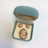 A small oval cameo of a lady's head together with