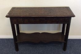 A large Edwardian oak carved rectangular side tabl