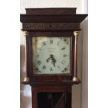 A small oak cased grandfather clock with plank fro