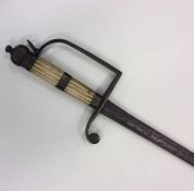 A brass and ivory mounted sword with textured hand