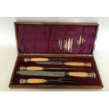 A good silver mounted carving set with turned hand