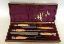 A good silver mounted carving set with turned hand