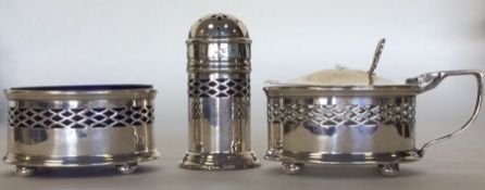 A small silver three piece cruet set. Birmingham.