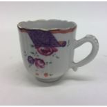 An attractive Famille Rose coffee cup with floral