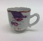 An attractive Famille Rose coffee cup with floral