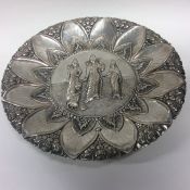 An Indian silver circular dish decorated with Budd