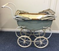 An Antique child's pram with painted decoration. E