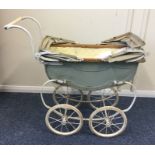 An Antique child's pram with painted decoration. E