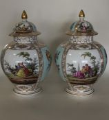 A pair of Dresden porcelain oviform vases painted with courting