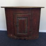 A Continental painted pine corner cupboard with hi