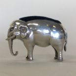 An unusual novelty silver pin cushion in the form