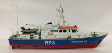 A large model of A River Police boat numbered RP3
