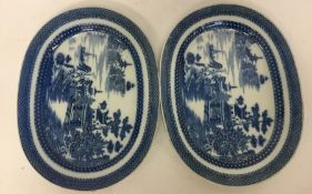 A pair of blue and white oval pearlware plates dec