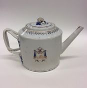 A Chinese cylindrical armorial teapot decorated wi