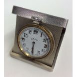 A good quality silver eight day travelling clock w