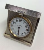 A good quality silver eight day travelling clock w