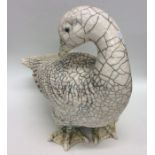 LAWSON RUDGE: A figure of a duck with crackleware