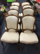 A set of eight French upholstered chairs with carv