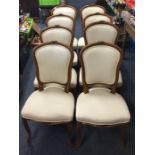 A set of eight French upholstered chairs with carv