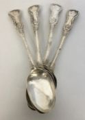 A heavy set of four kings' pattern silver serving