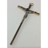 A small brass mounted crucifix with loop top. Est.