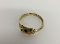 A 9 carat sapphire and diamond ring. Approx. 3 gra