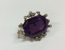 An attractive Victorian amethyst and diamond brooc