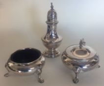 A good quality silver three piece cruet set on hoo