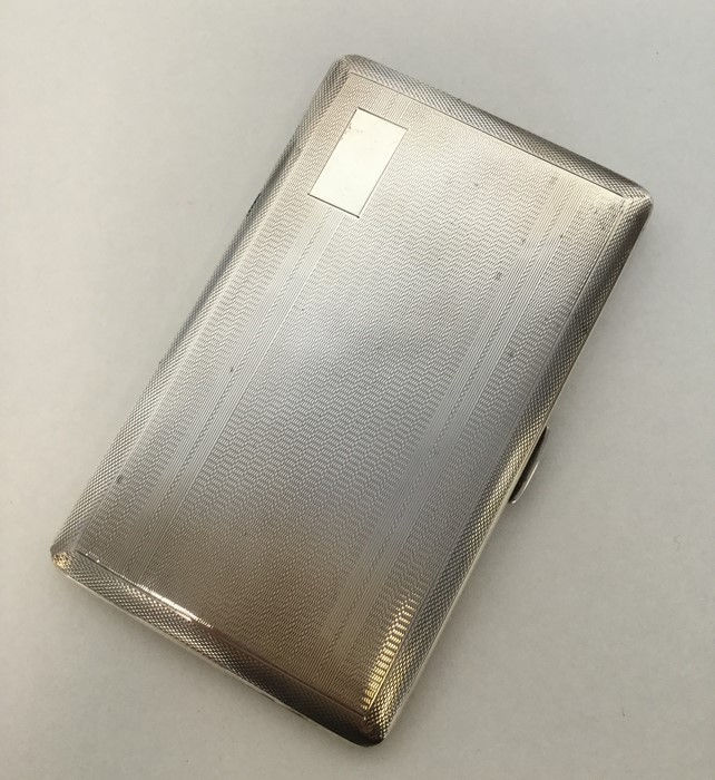 A heavy silver engine turned cigarette case with g - Image 2 of 2