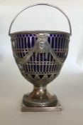 A Georgian silver swing handled basket, the body d