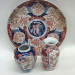 A large circular Imari wall charger decorated in b