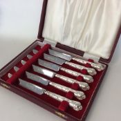 A boxed set of six silver kings' pattern tea knive