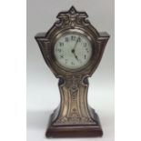 A large silver mounted mantle clock in mahogany ca