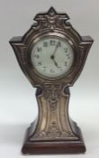 A large silver mounted mantle clock in mahogany ca