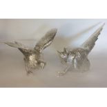 A good pair of cast silver models of pheasants wit